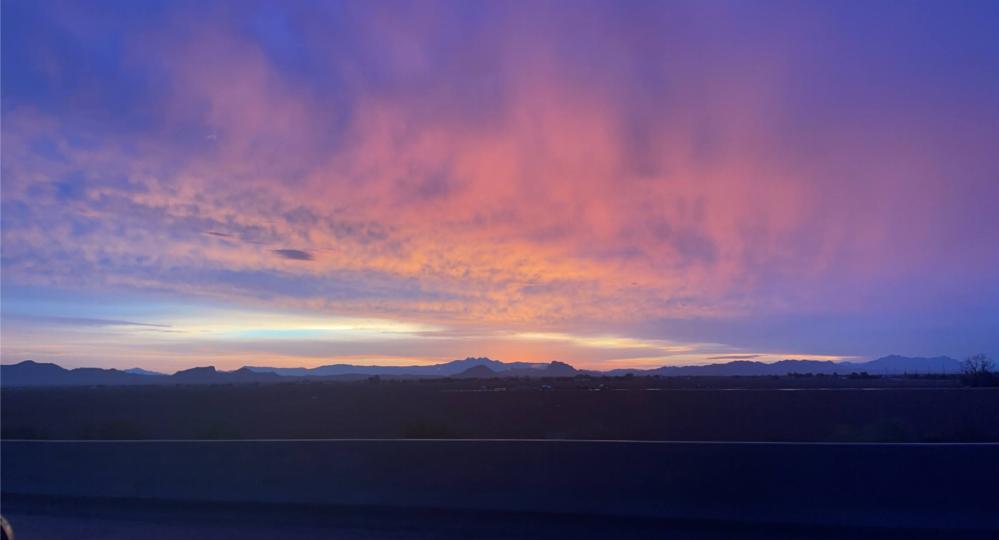 blue, purple, pink, orange, and yellow sunrise along highway 101 North in Phoenix, Arizona