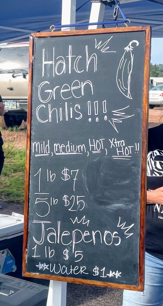 chalkboard advertising hatch green chilis and jalapeños at Payson Farmers Market in Arizona