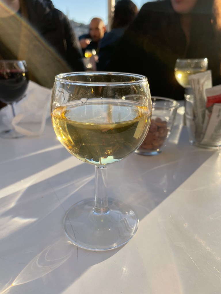 a glass of white wine while waiting for my train in Marseille