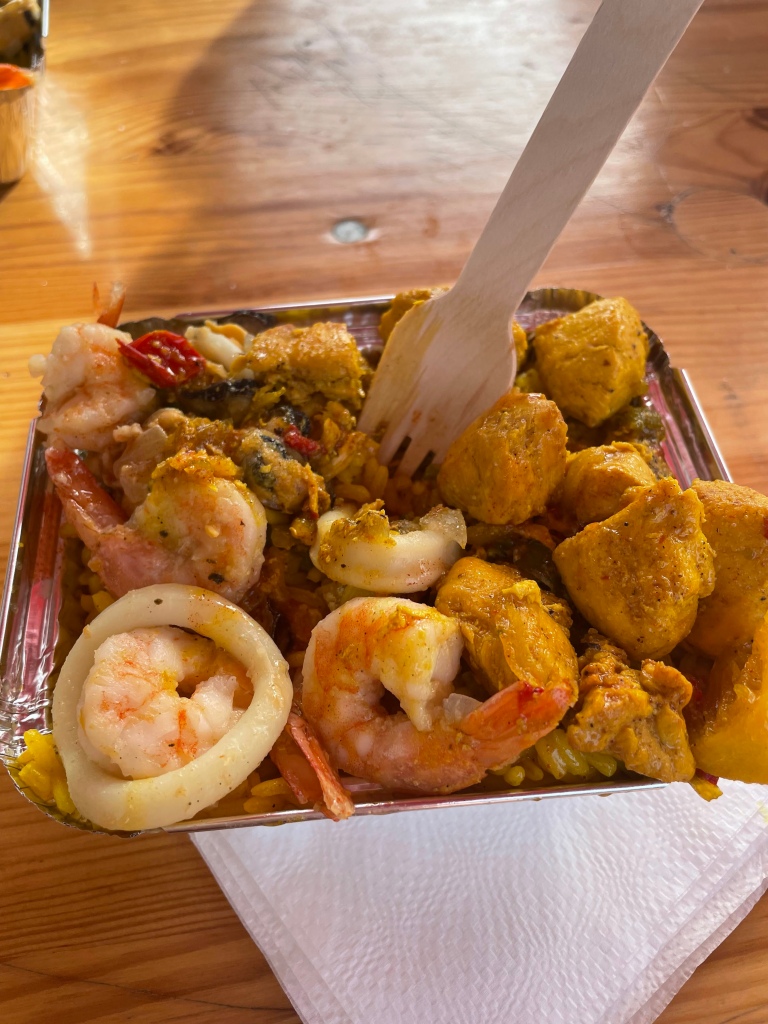 Paella takeout  with shrimp from a stand near the Eiffel Tower