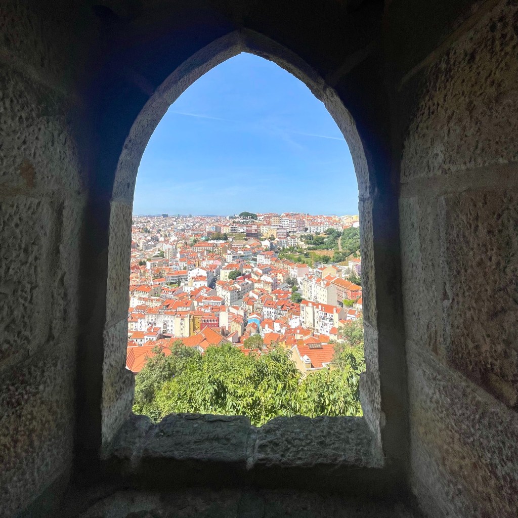 View from a stone window inside Castelo de São Jorge in Lisbon, Portugal