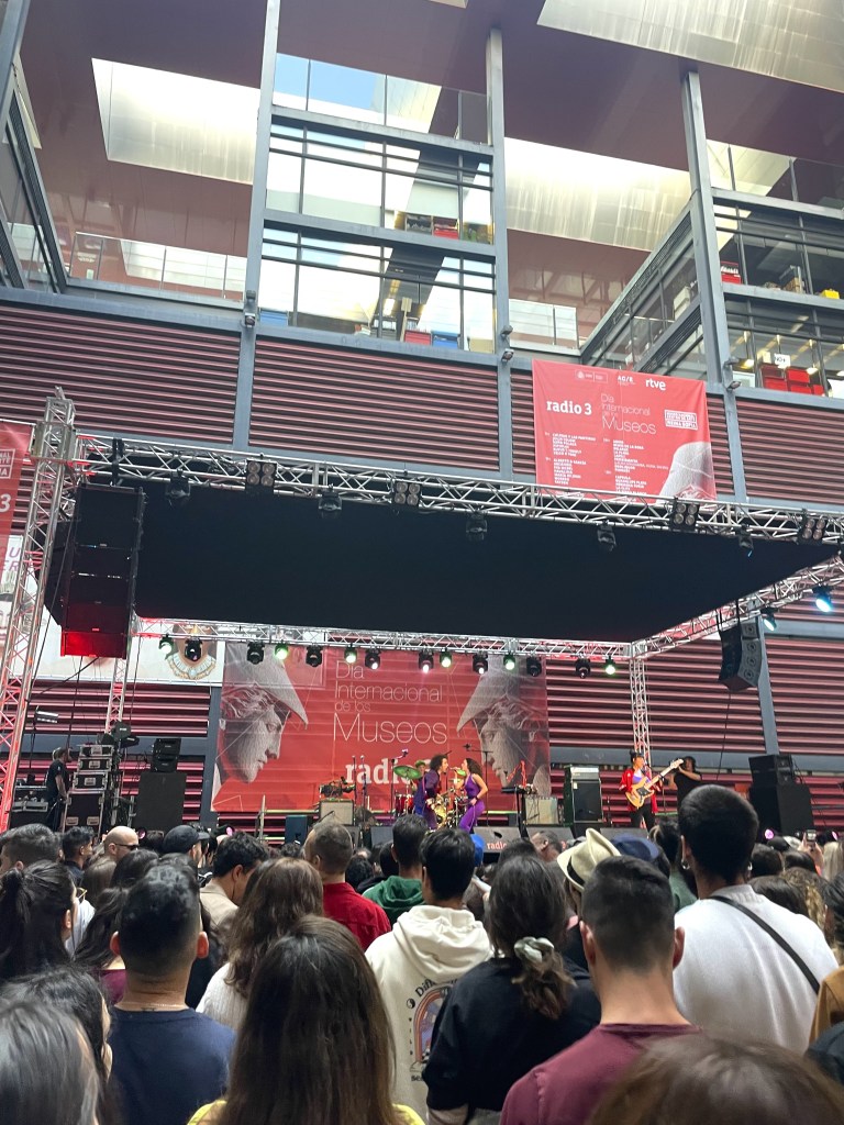A crowd of people enjoying a free Spanish music festival in the heart of Madrid, Spain