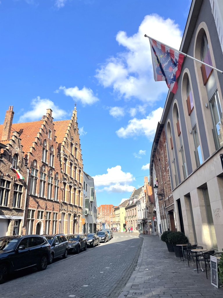 The quiet streets of Bruges, Belgium featuring buildings with gothic archtitecture