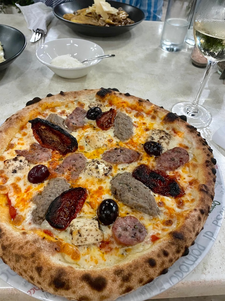 The best pizza I've ever eaten in Europe from a restaurant on the island of Malta. Pizza is topped with soppressata, Sicilian sausage, gorgonzola cheese, and olives.