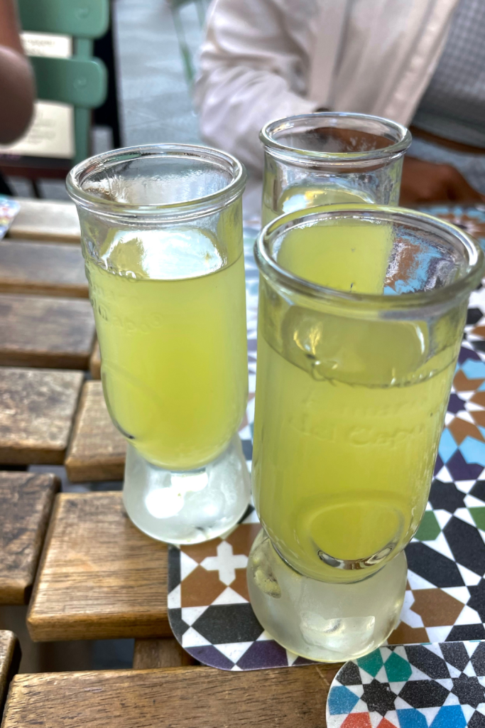 Three shooters of limoncello at a trattoria in Florence, Italy