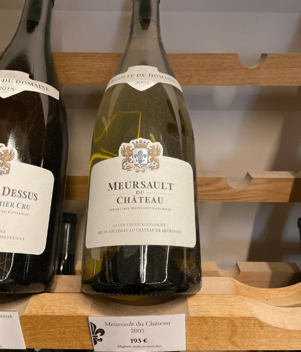 A bottle of wine on a rack at a château in the Burgundy region of France