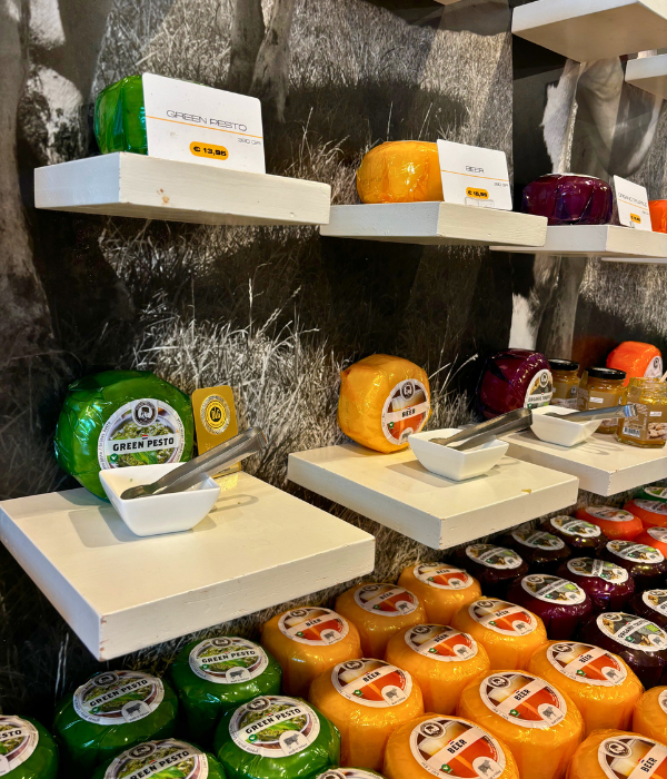A cheese shop in Amsterdam, the Netherlands, showcasing a wide variety of different Gouda cheeses with free samples