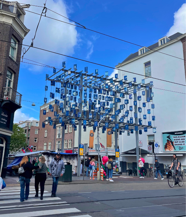 Walking up to Amsterdam's largest outdoor market at Albert Cuyp Market on a sunny summer day.