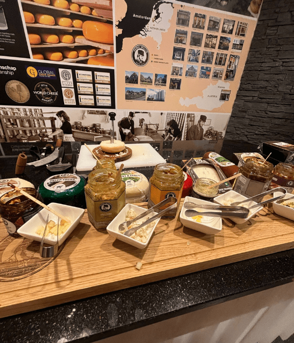 Free samples of Gouda cheese and mustard at a cheese shop in Amsterdam, the Netherlands