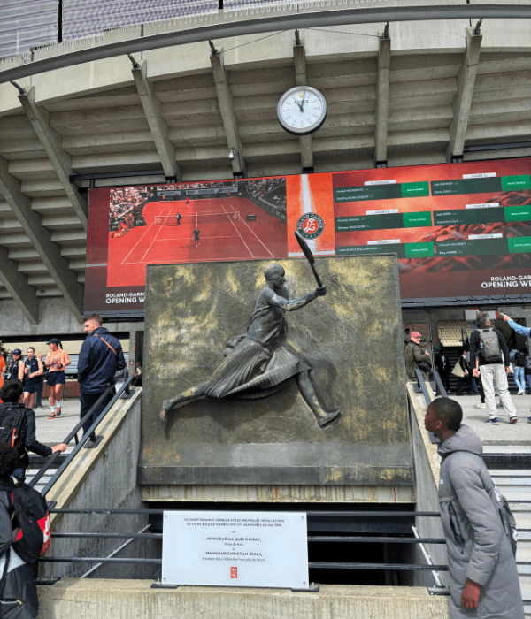 Old yet classic statue / sculpture of a tennis player as you enter Stade Roland Garros for the French Open in Paris.