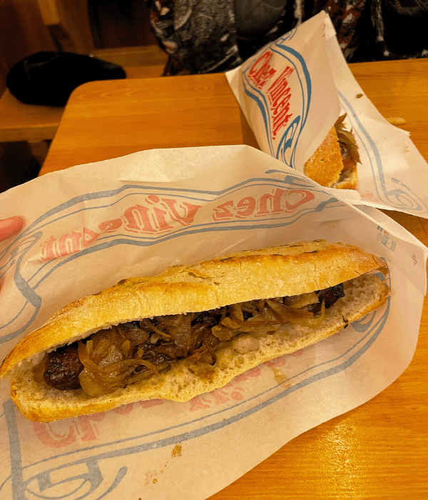 A bratwurst on a baguette at the Christmas market in Paris.