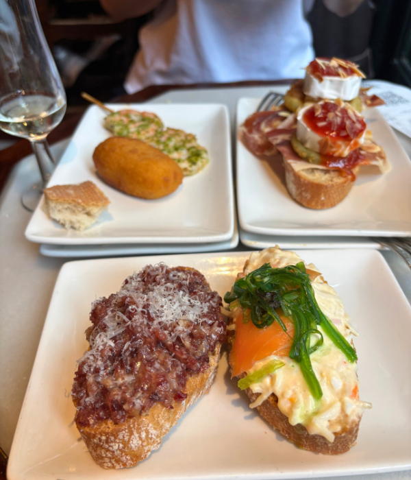 Round two of our pintxos, with a jambon on baguette, salmon on baguette, shrimp, croquetta, and goat cheese.